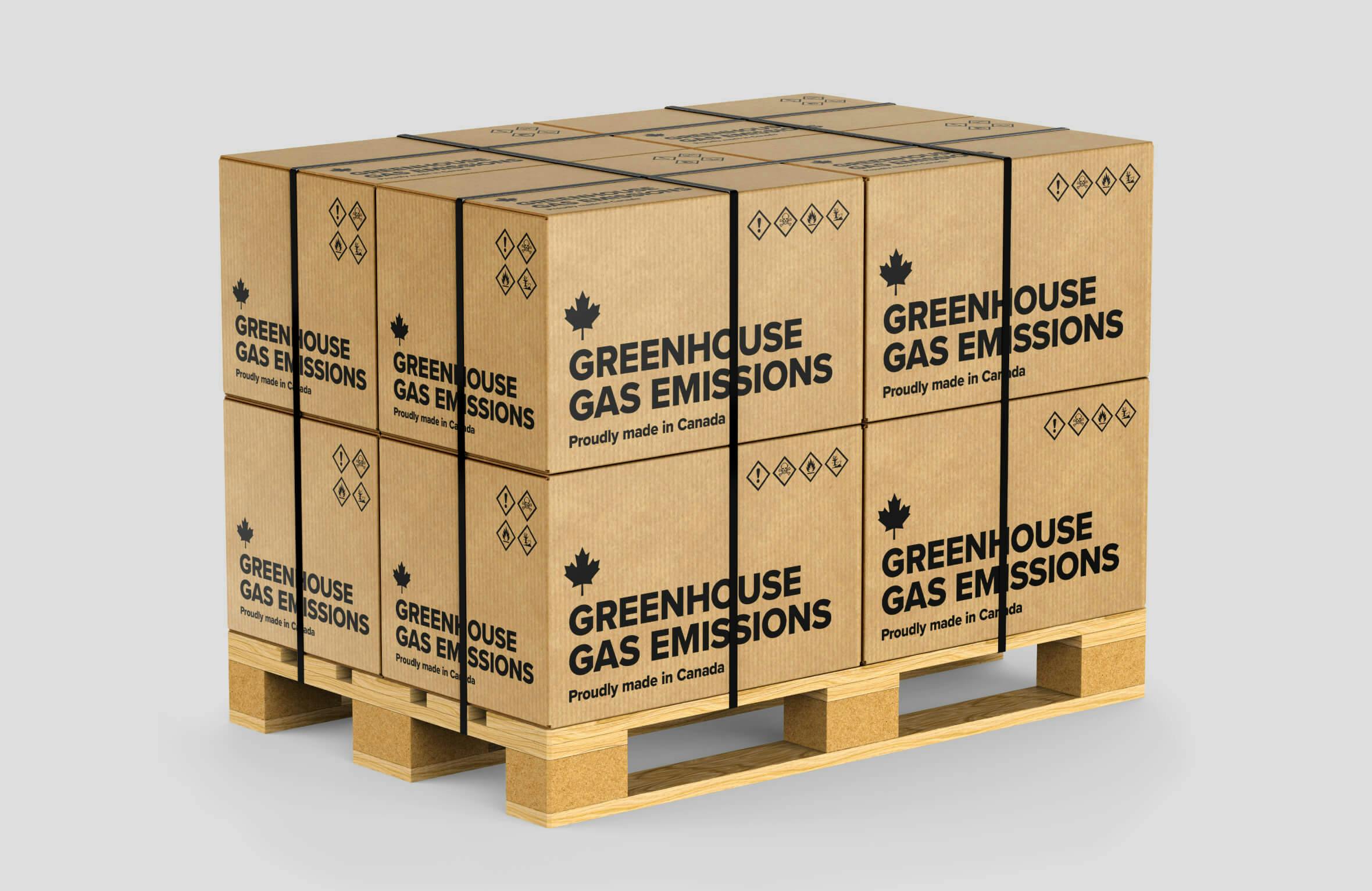 Mockup of a stack of branded cardboard boxes with labels that say "greenhouse gas emissions, proudly made in Canada" as a social commentary piece on climate change. Data released by the International Energy Agency in 2018 indicated that Canada was one of the top 10 greenhouse gas emitters in the world.